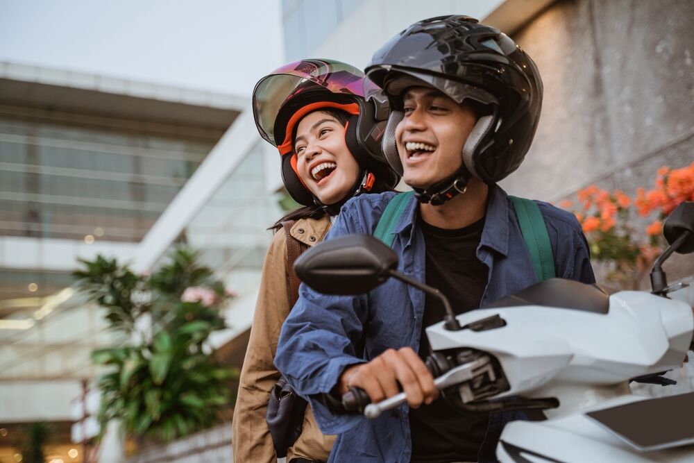 Man Woman Laughing While Riding Motorcycle